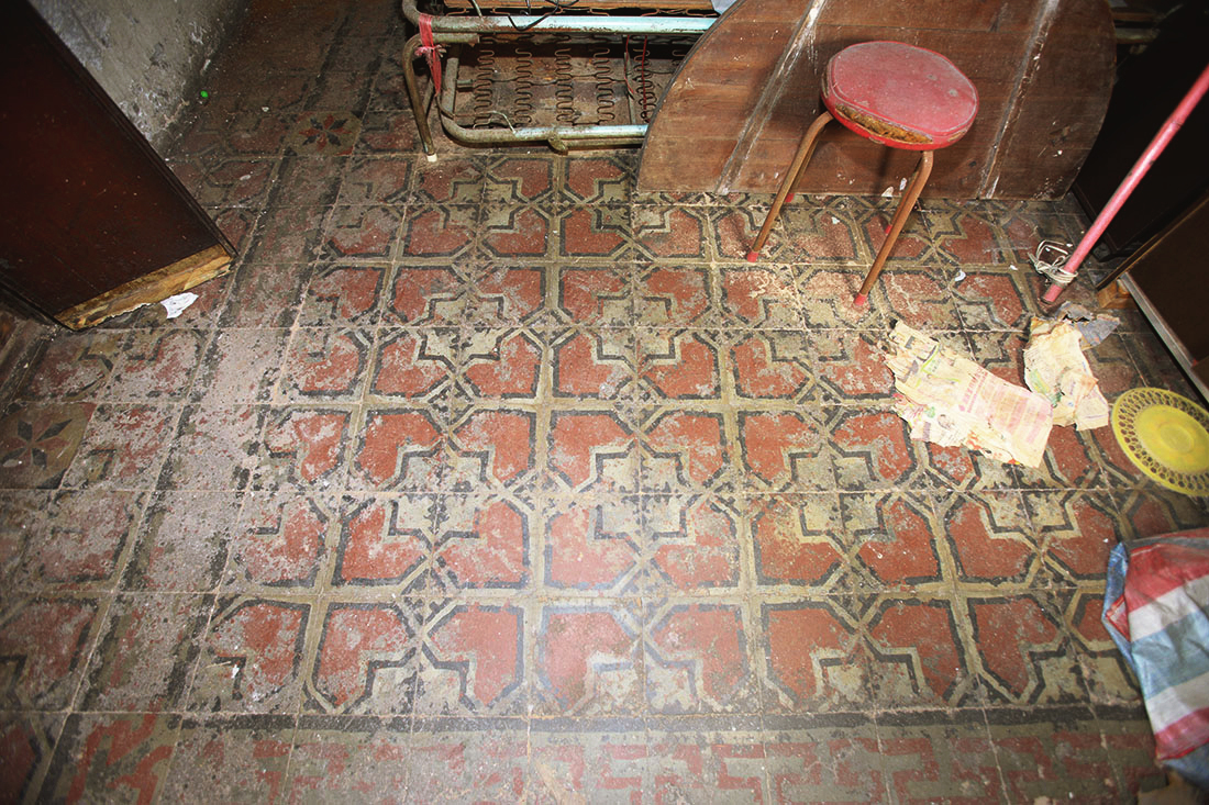 The photo taken in 2015 showing the original floor tiles in a unit ahead of the revitalisation project.